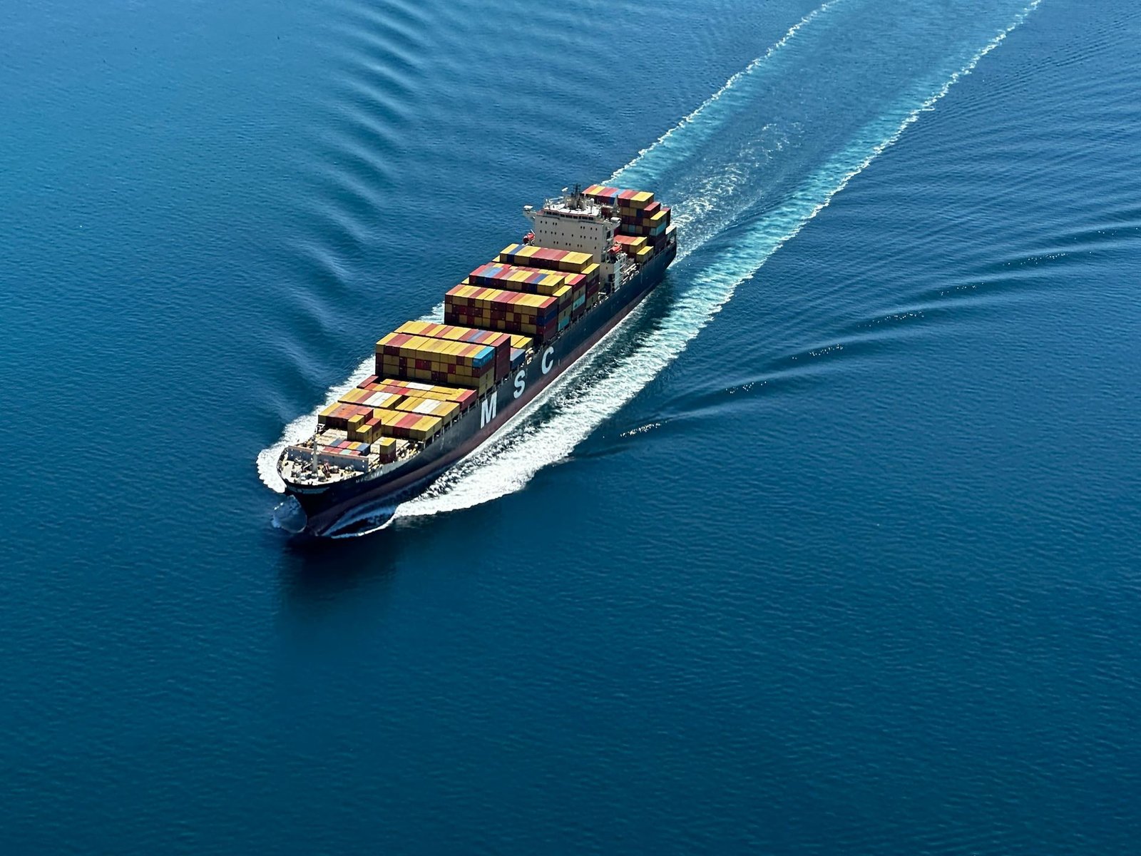 Aerial view of a container ship at sea